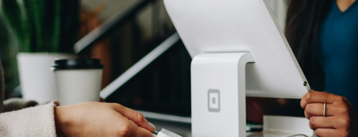 white monitor on desk