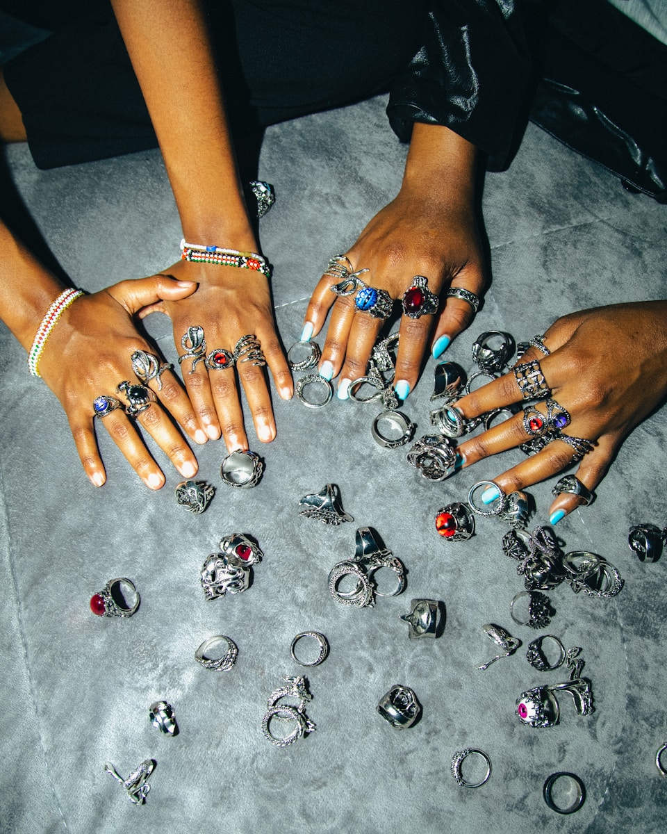 A group of people with rings on their hands